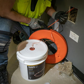 Klein Tools Poly Pull Line orange tracer for easy line identification on site.