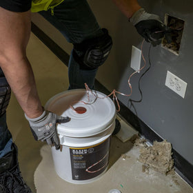 Klein Tools Poly Pull Line tangle-free storage container keeps line ready.