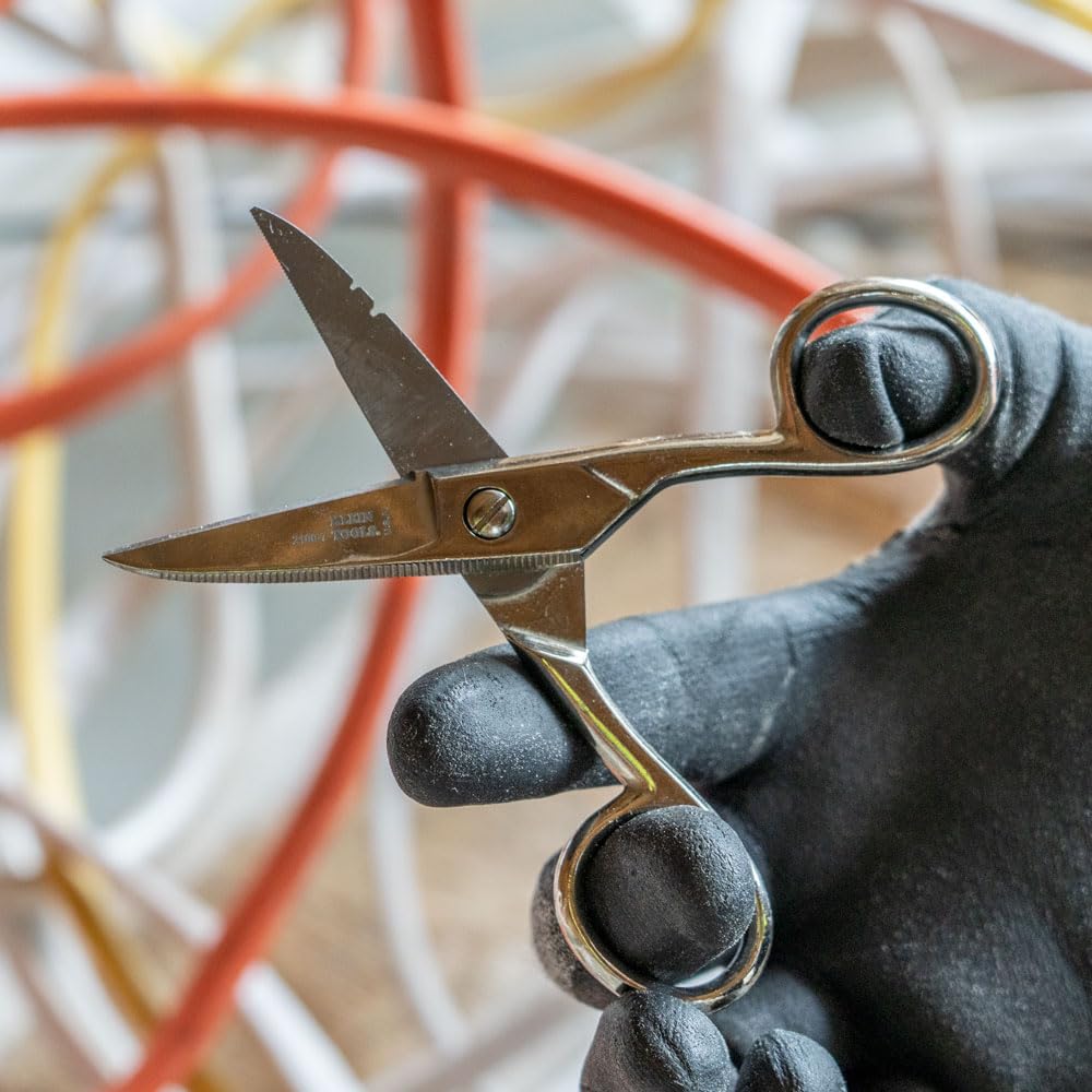 Knife with textured handle for a secure grip during delicate splices.