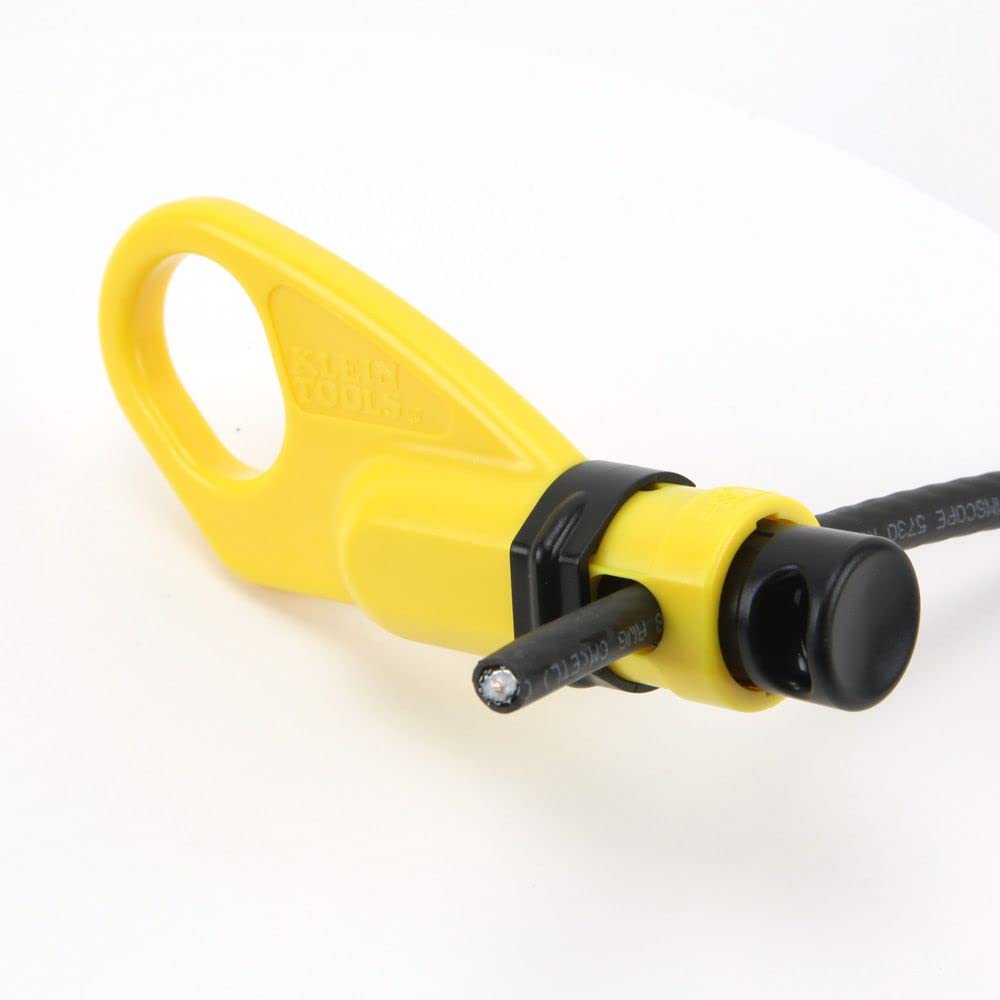 Klein Tools VDV110-061 user applying coax stripping on a cable