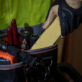 Klein Tools ruler on yellow blade with black markings for high visibility.