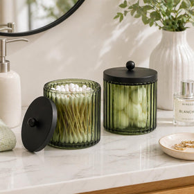 KMwares olive green glass canister on vanity highlights stylish organization