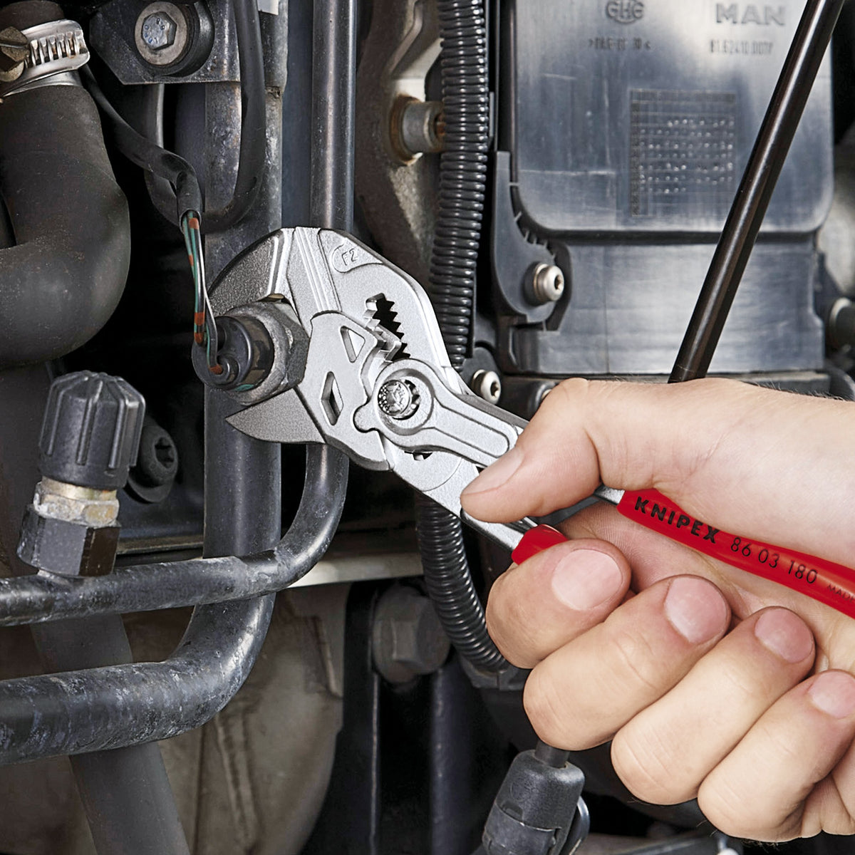 KNIPEX three-piece pliers wrench set displayed in a tool collection for professionals