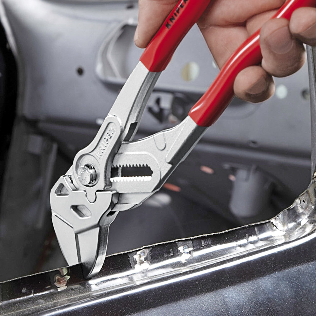 KNIPEX three-piece wrenches in use on a bench for adjustable gripping