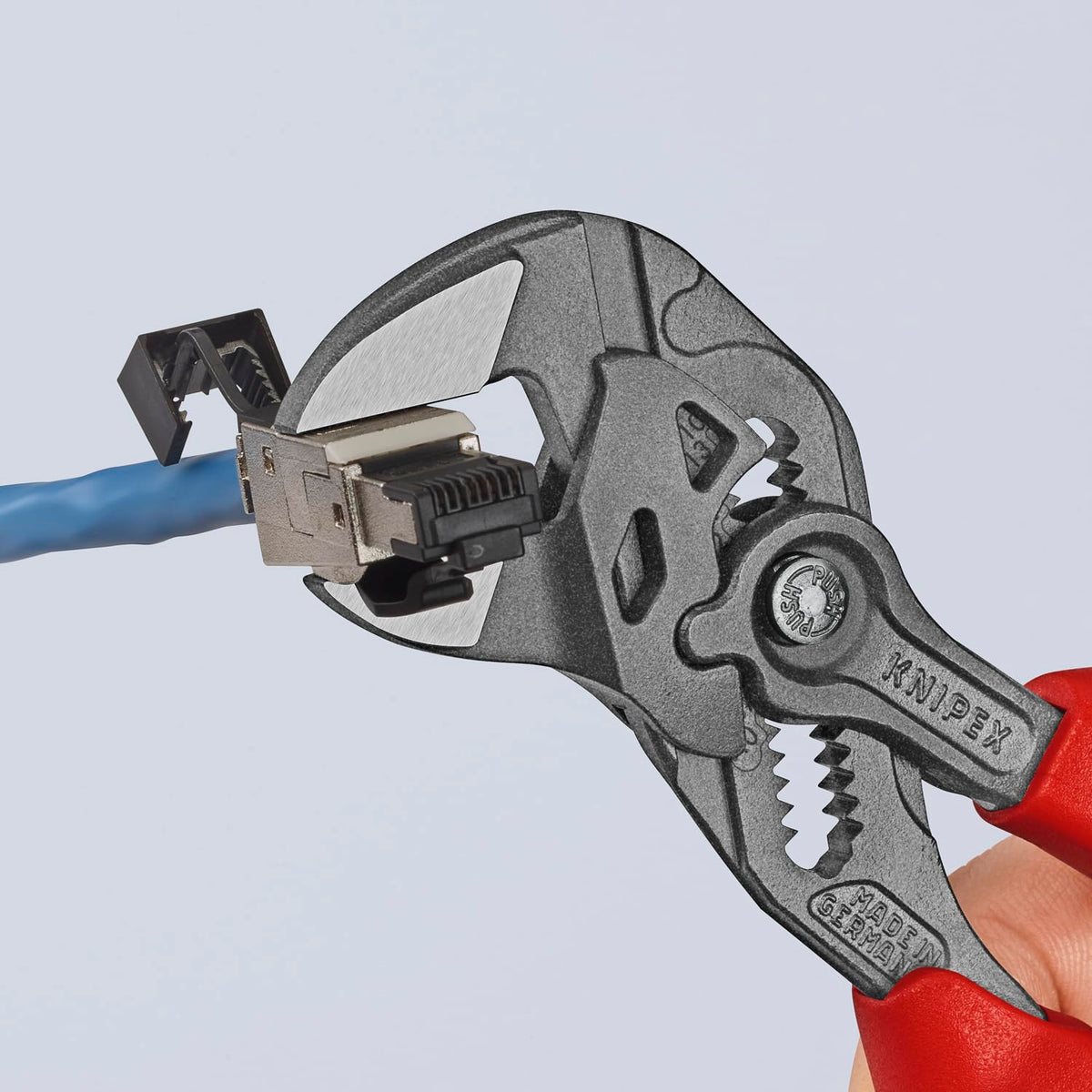 KNIPEX wrench in use demonstrates adjustable grasp on hex fasteners