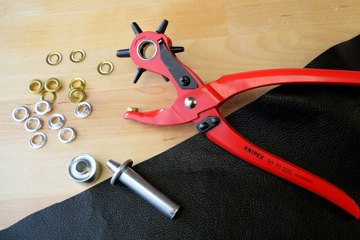 KNIPEX interchangeable punches set with six hole sizes for textiles, leather, and plastic.