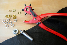 KNIPEX interchangeable punches set with six hole sizes for textiles, leather, and plastic.