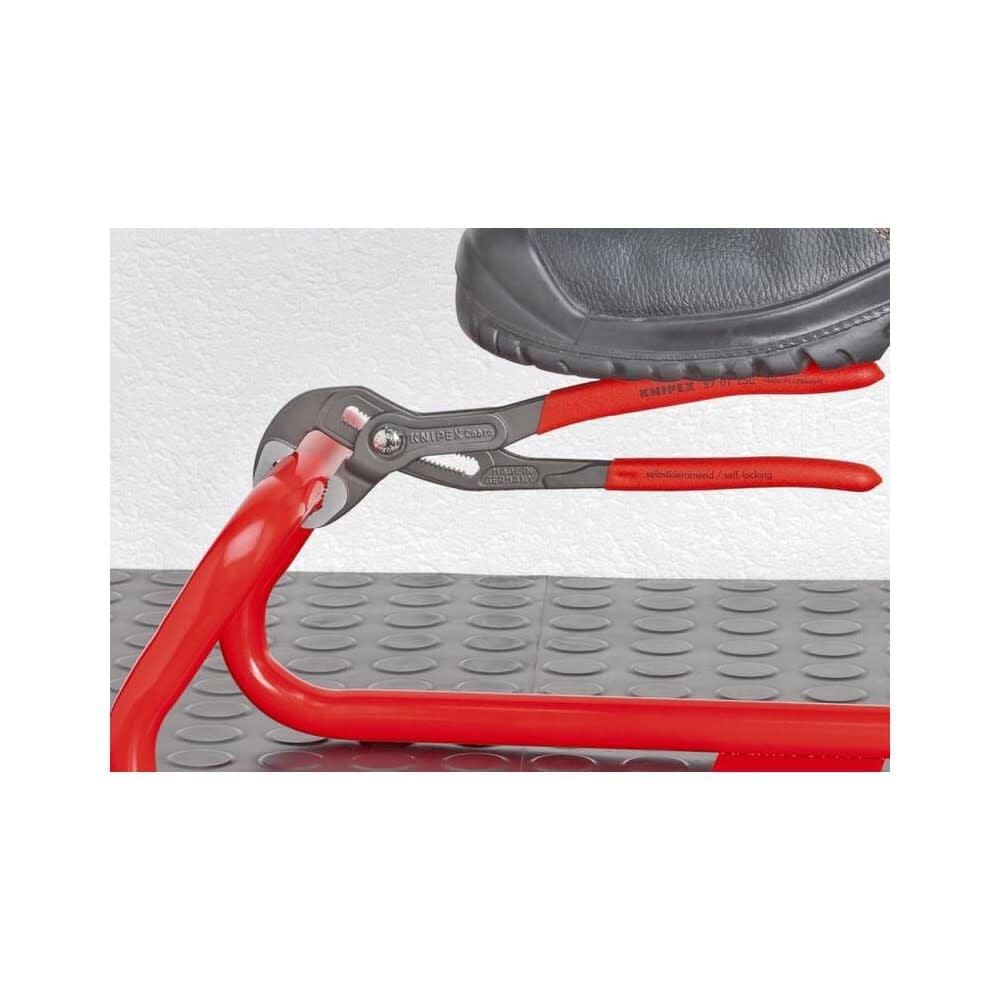 Pinch guard on KNIPEX Cobra pliers helps protect fingers during use