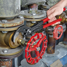KNIPEX Cobra in-use on pipes and nuts shows secure grip.