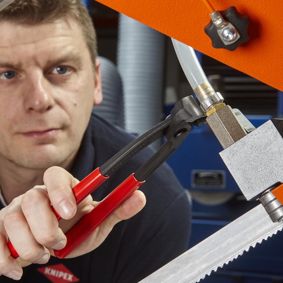 Knipex professional automotive assembly tool in action