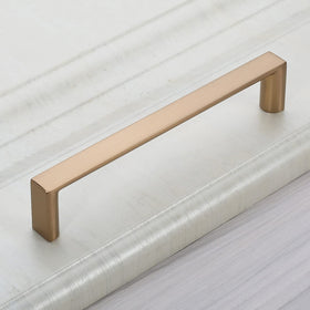 KNOKLOCK close-up shows champagne bronze finish and square shape.