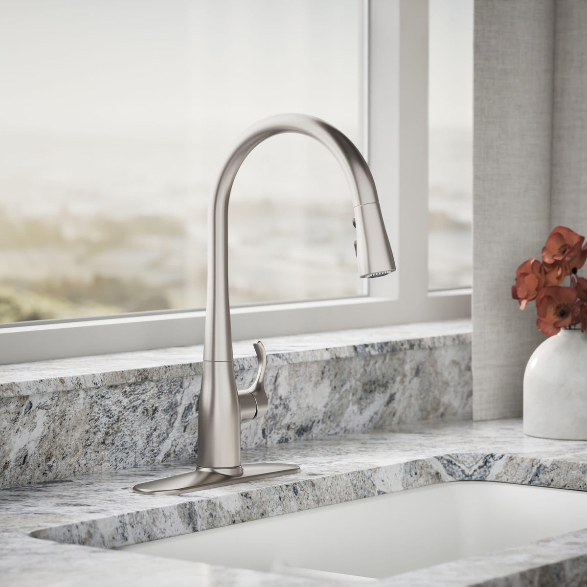 Simplice high-arch spout offers ample clearance for pots