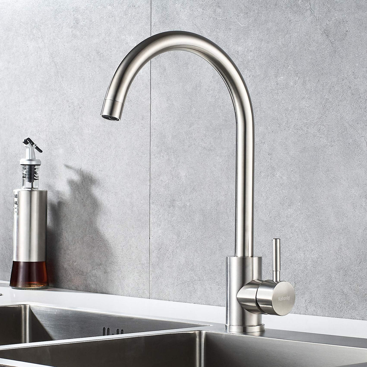 KOHONBY 360-degree rotation faucet enables flexible cleaning across two sinks.