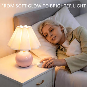 Komothala bedside lamp ideal for nightstands and small spaces.