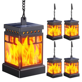 Kooper hanging solar lantern with dancing flame lighting an outdoor patio