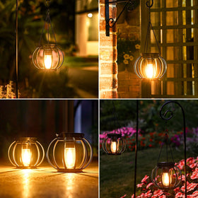 KOOPER lanterns light pathways for inviting garden strolls
