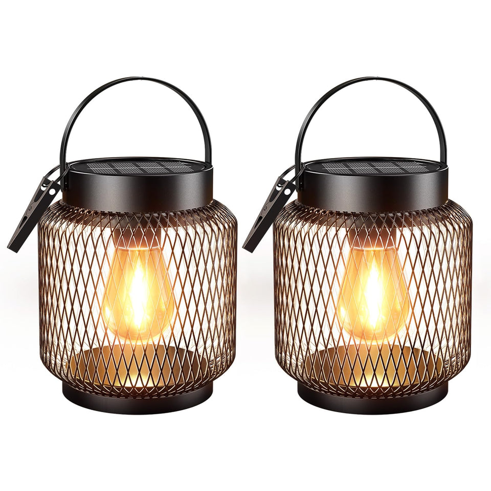 KOOPER metal solar lanterns in a 2-pack illuminate an outdoor patio with durable waterproof design.