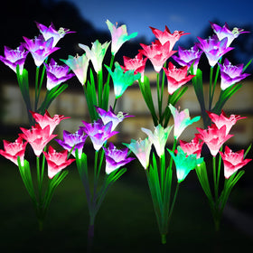 KOOPER outdoor solar lights with bigger lily flowers illuminate garden paths softly.