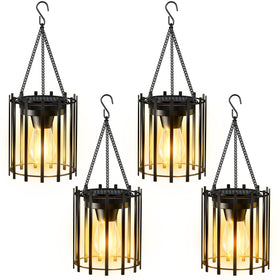 KOOPER solar lantern hanging from a tree branch for warm outdoor ambiance.