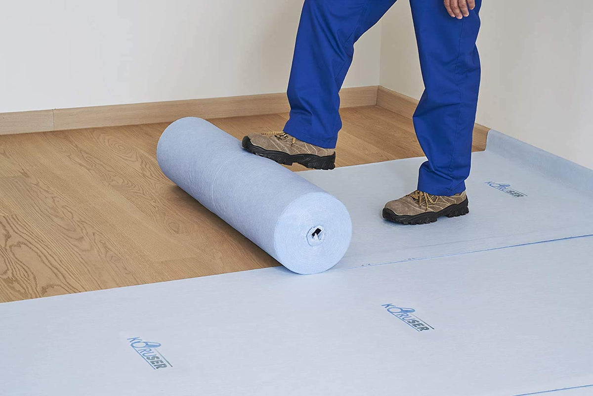 KORUSER temporary floor protection roll-out protecting surfaces from spills and paint during projects.