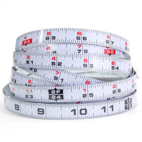 Kreg 12-foot self-adhesive measuring tape on a workbench provides left-to-right layout reference.