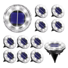 Krinzitt mini solar light on lawn providing subtle, energy-efficient glow along the path
