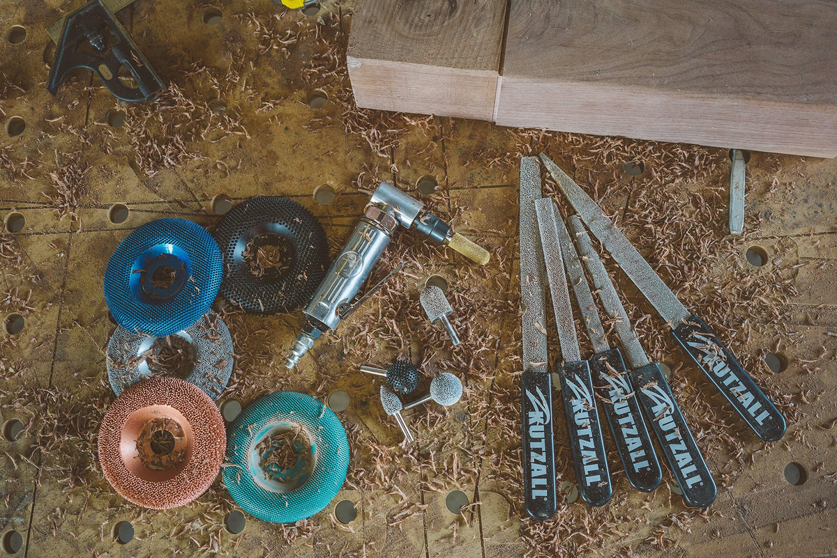 Kutzall USA-made burr kit ready for precision wood carving in a workshop.