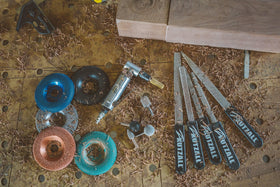 Kutzall USA-made burr kit ready for precision wood carving in a workshop.