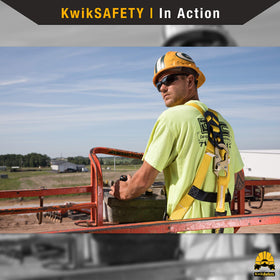 KwikSafety SCORPION harness back view shows full-body coverage on-site.