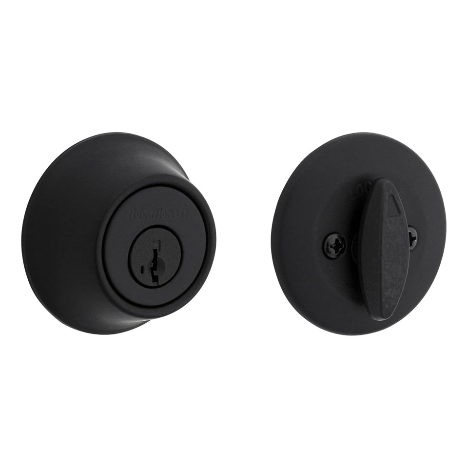 Kwikset 660 matte black deadbolt on a front door for secure entry.