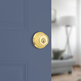 Kwikset 660 deadbolt interior thumb-turn for quick inside locking.
