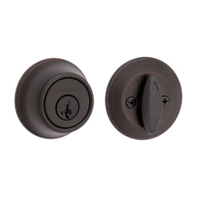 Kwikset 660 deadbolt in Venetian Bronze secures the front door with reliable protection.