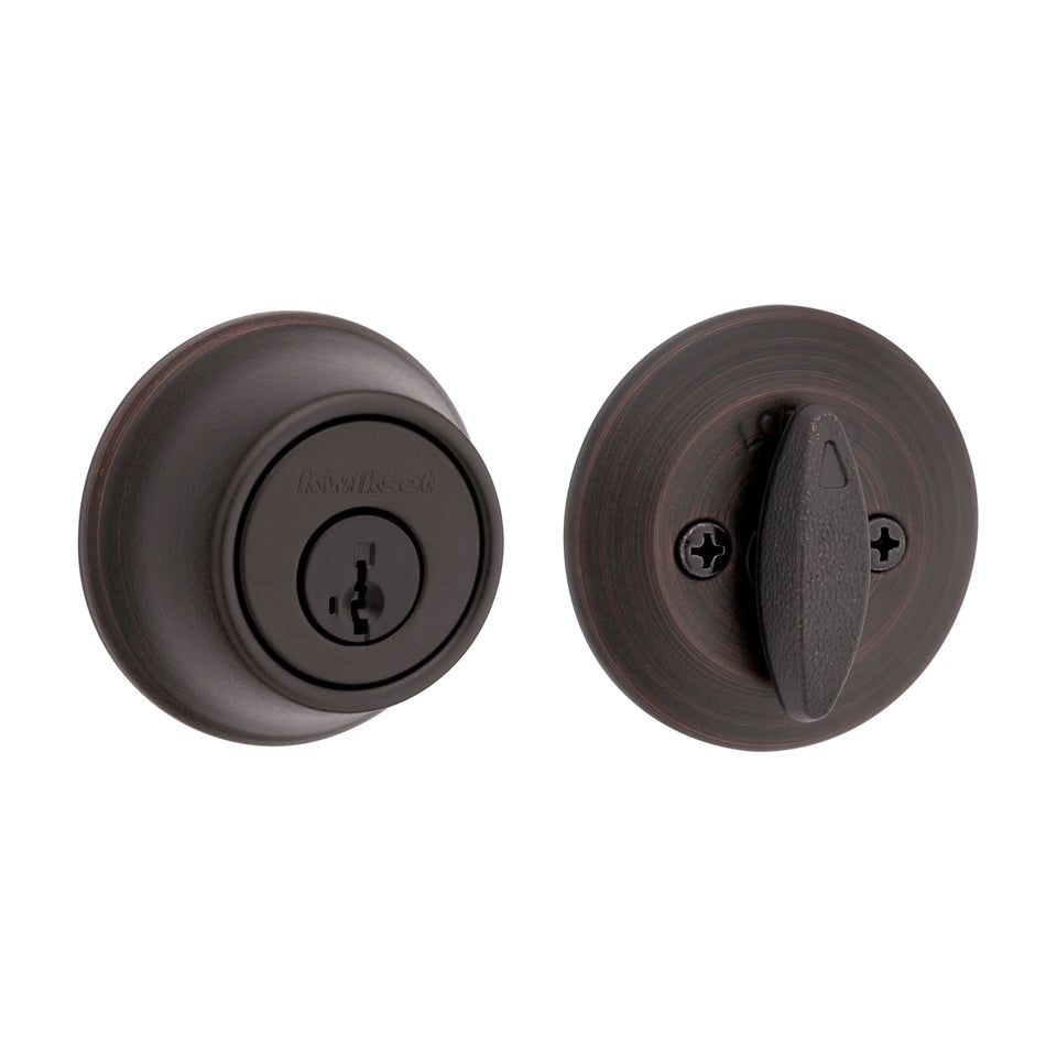 Kwikset 660 deadbolt in Venetian Bronze secures the front door with reliable protection.