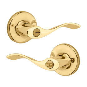 Kwikset Balboa entry door handle with polished brass exterior, front view