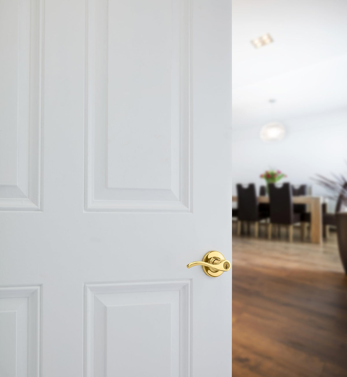 Kwikset Balboa exterior lever in polished brass, close-up