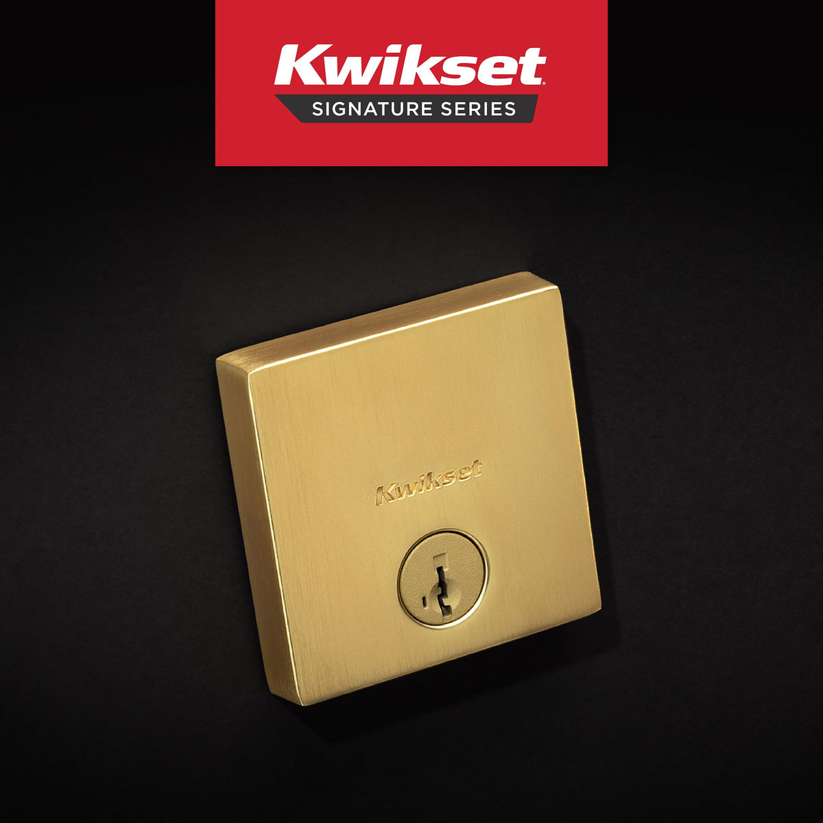 Kwikset Downtown deadbolt lock in satin brass square exterior.