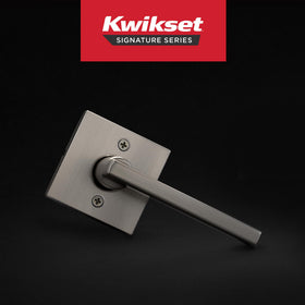Kwikset Halifax lever closeup satin nickel shows modern, minimalist design.