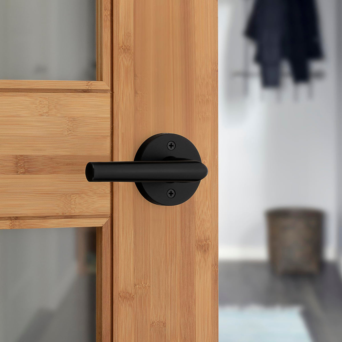 Kwikset Milan door handle matte black front view for interior doors.