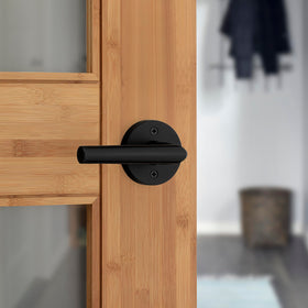 Kwikset Milan door handle matte black front view for interior doors.