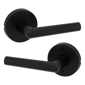 Kwikset Milan interior passage lever in matte black; modern closet door.