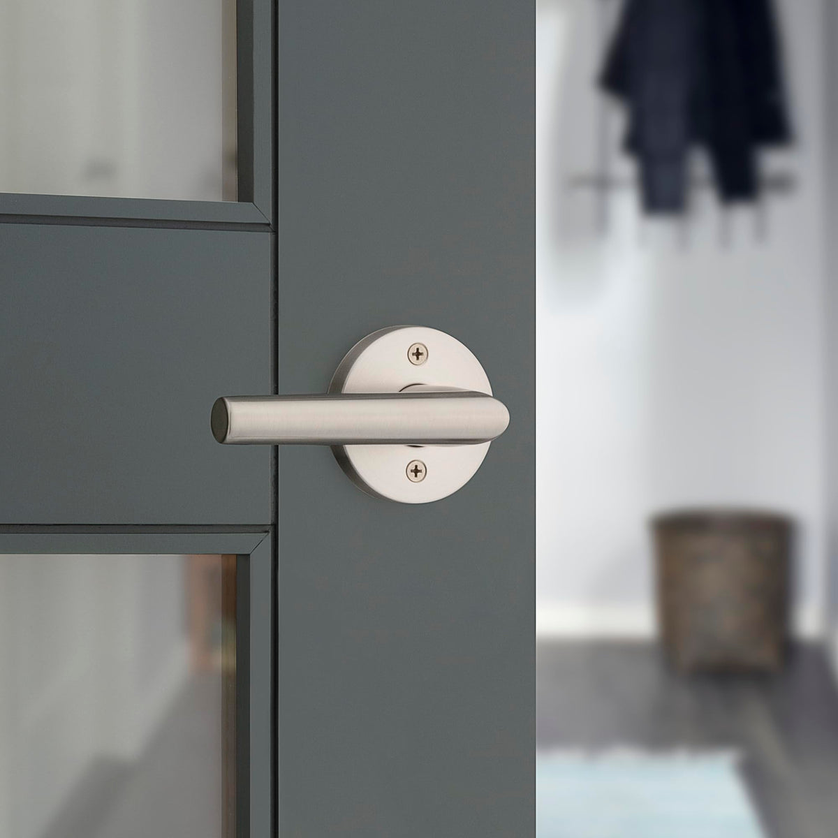 Kwikset Milan satin nickel finish close-up showing modern durable styling