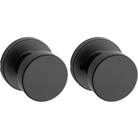 Kwikset Pismo interior passage knob in matte black for closets and hallways.