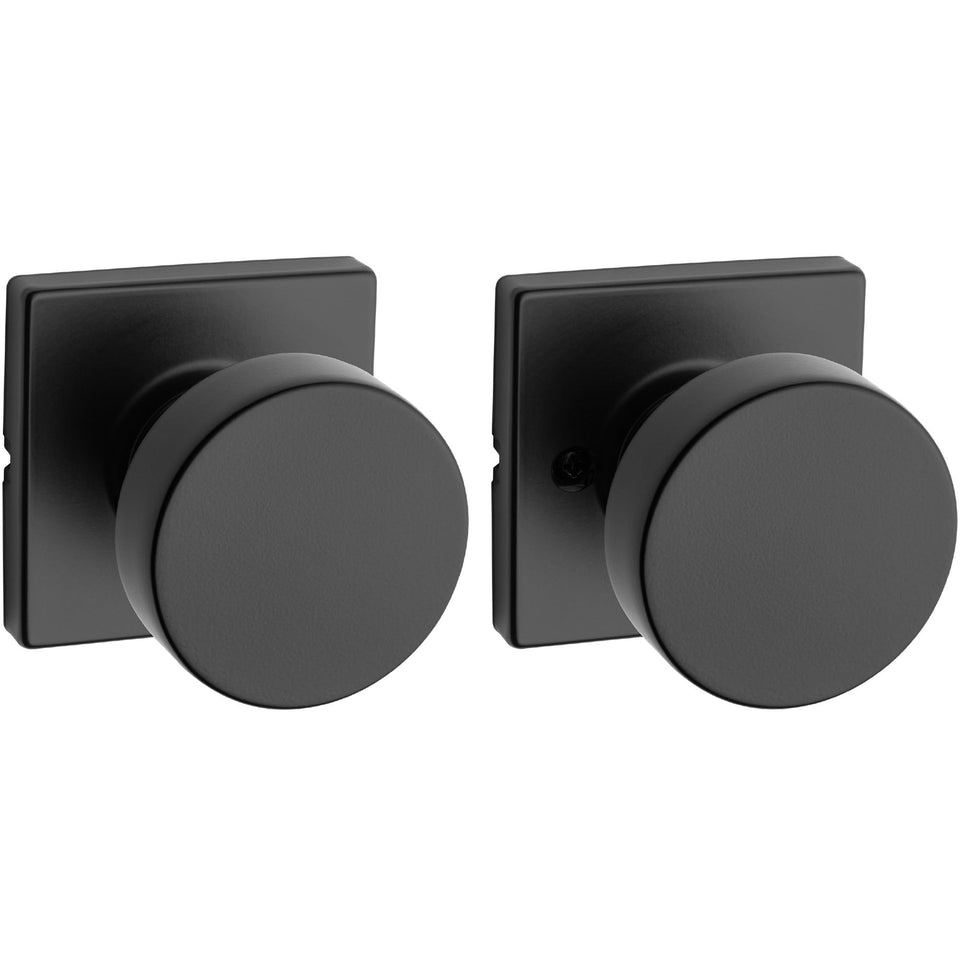 Kwikset Pismo interior passage knob in matte black for closets and hallways.