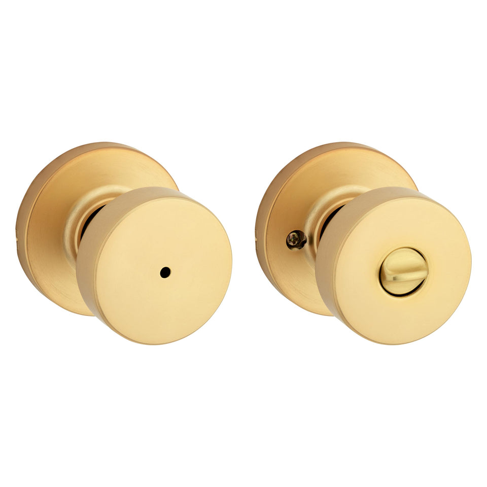 Kwikset Pismo interior privacy knob closeup with satin brass finish for refined interior doors.