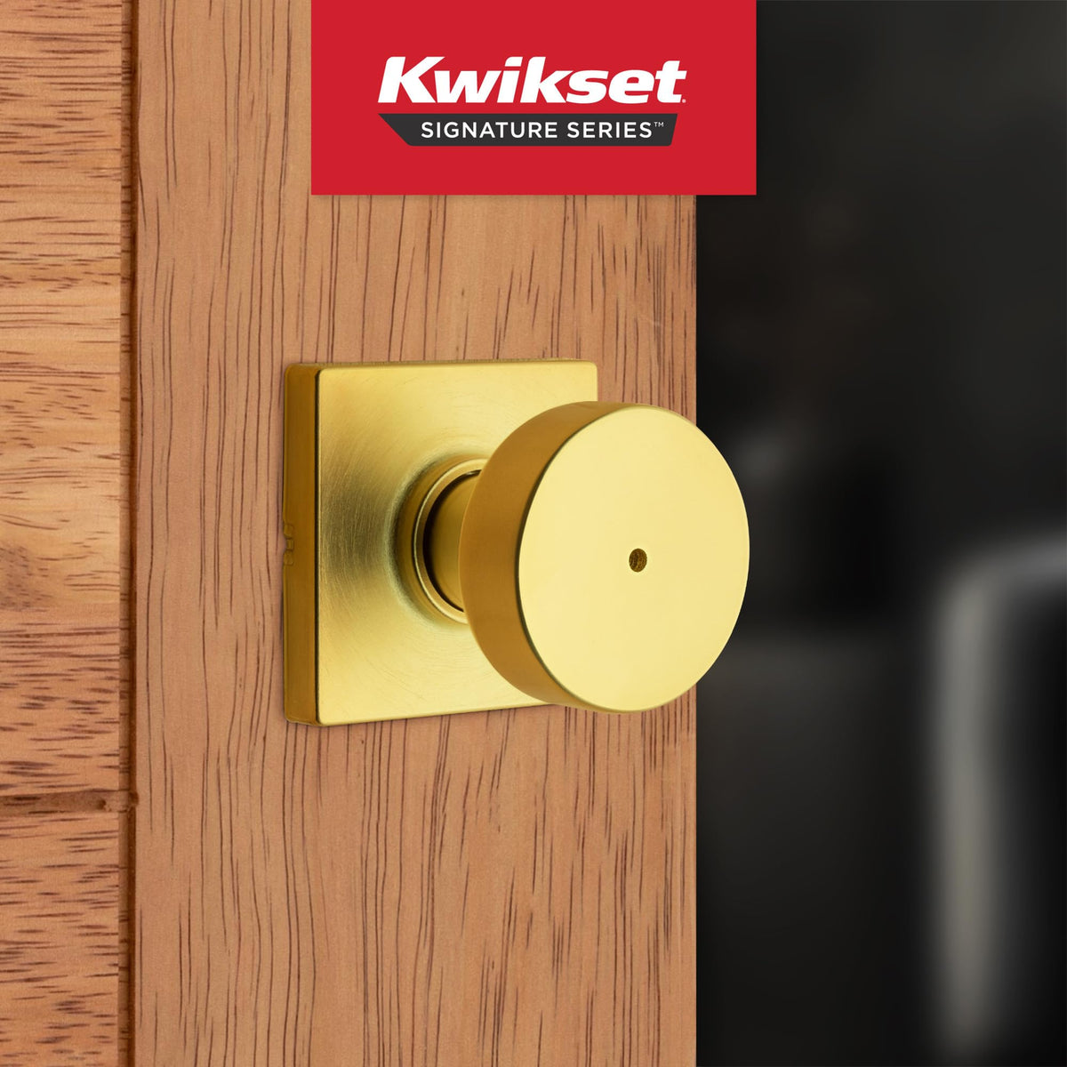 Kwikset Pismo privacy knob with round satin brass rose for bathrooms