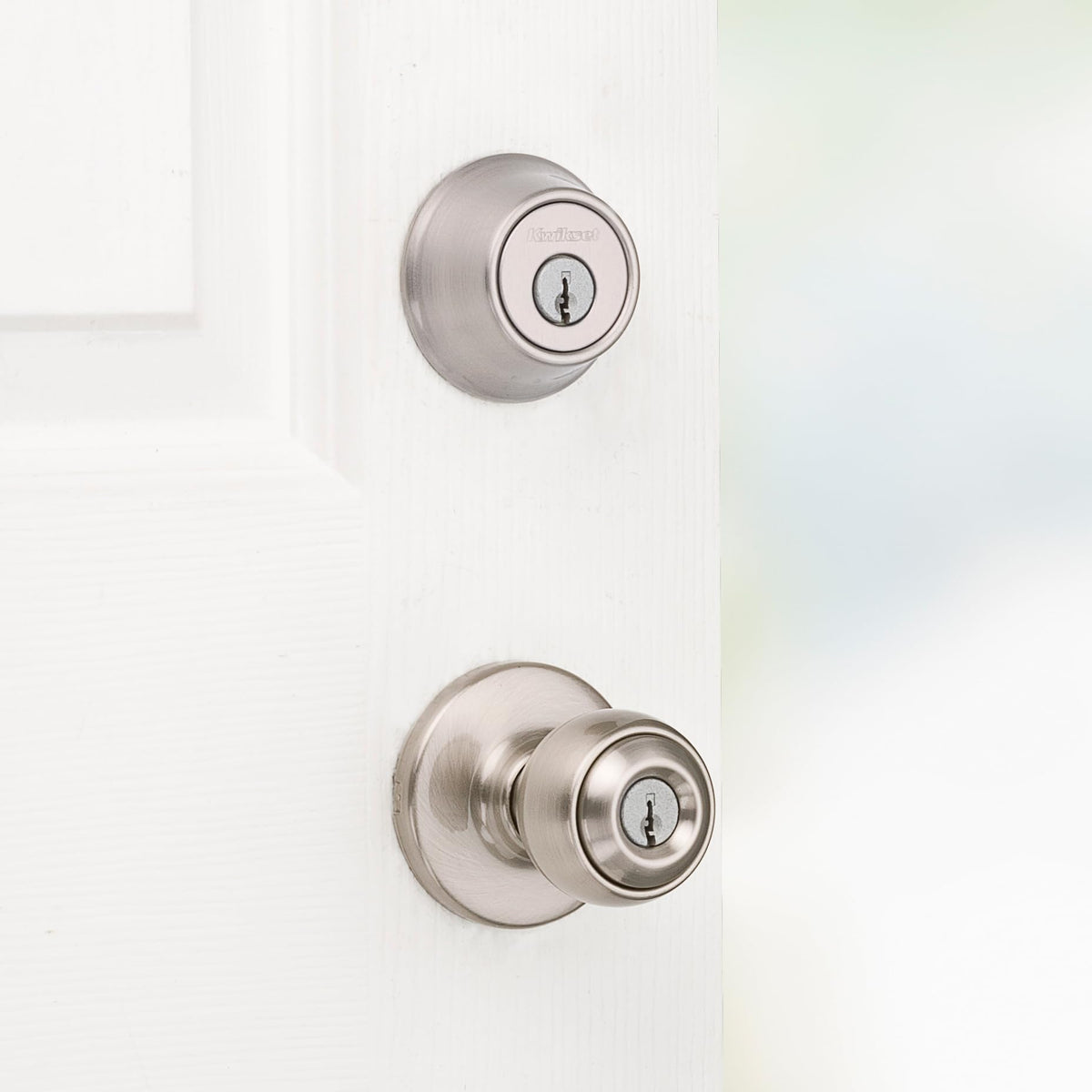 Kwikset Polo deadbolt satin nickel provides extra exterior door protection.