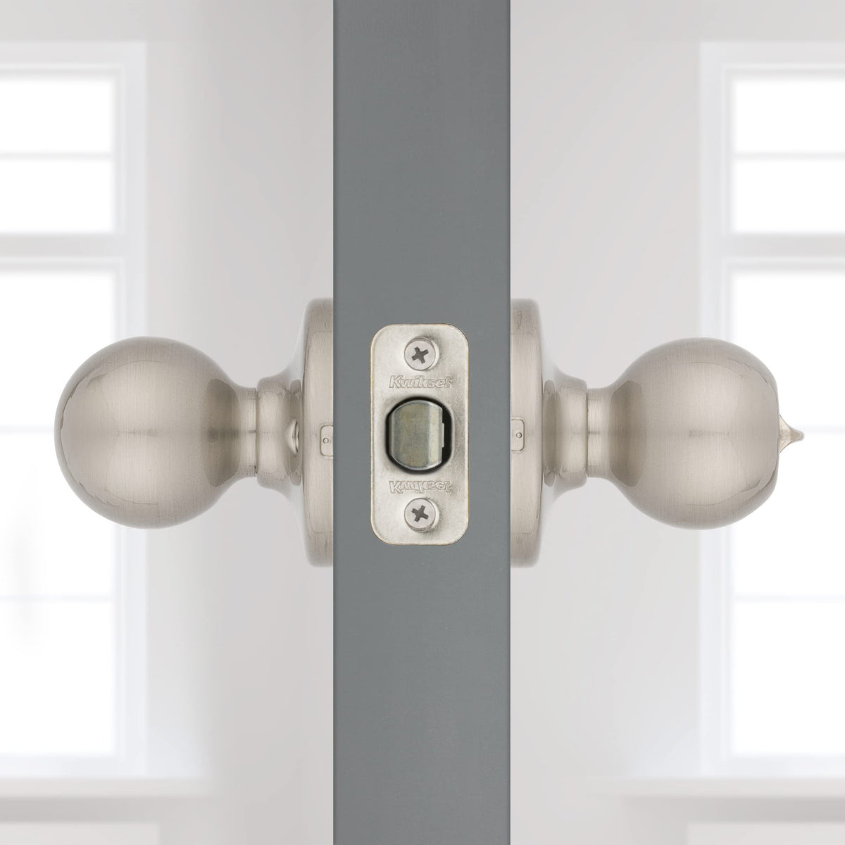Kwikset Polo installation hardware pack with screws and latch.