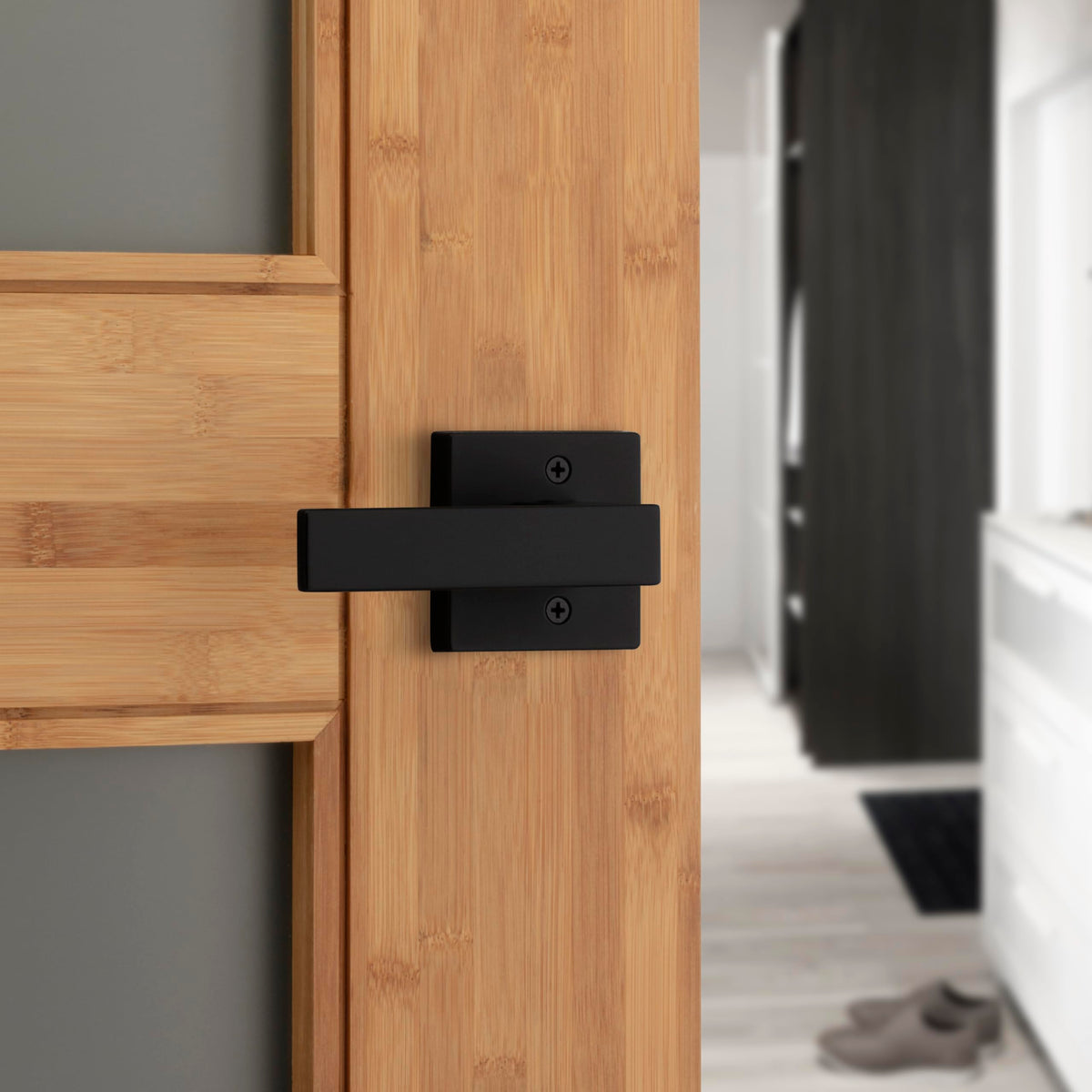 Kwikset Singapore privacy lock button on a matte black lever.