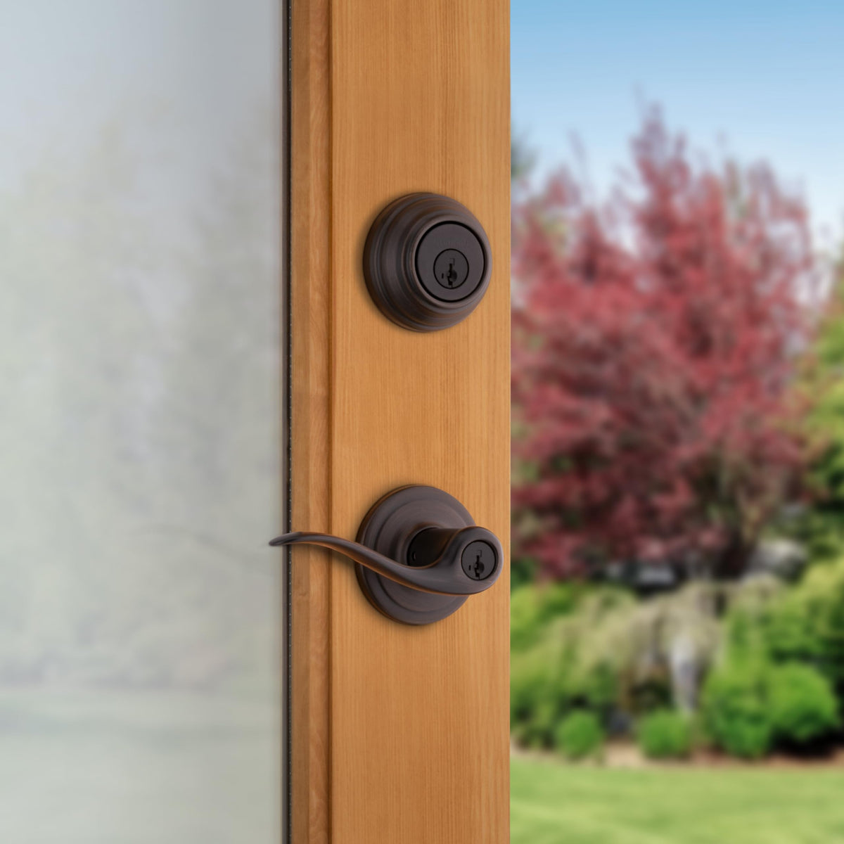 Kwikset Tustin deadbolt in Venetian Bronze provides secure exterior entry