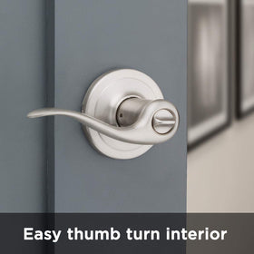 Satin nickel finish close-up on Kwikset Tustin lever hardware.